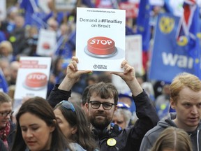 Demonstrators protest against Britain's split from Europe in Birmingham, England, Sunday Sept. 30, 2018, as the ruling Conservative Party start their annual Conference. Party conferences are usually a chance for leaders to rally their troops and for parties to unveil new voter-friendly policies. Theresa May's goal at this four-day gathering, however, will be surviving atop a fractious and febrile party that is convulsed over Brexit.