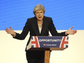 Conservative Party Leader and Prime Minister Theresa May addresses delegates during a speech at the Conservative Party Conference at the ICC, in Birmingham, England, Wednesday, Oct. 3 , 2018.