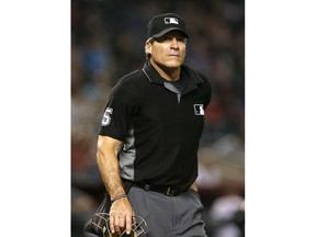 FILE - In this Sept. 3, 2018 file photo, MLB umpire Angel Hernandez (5) is seen in the first inning during a game between the Arizona Diamondbacks the San Diego Padres, in Phoenix. Calls by first base umpire Hernandez were overturned in three of four video reviews during the Boston's 16-1 rout of the New York Yankees in Game 3 of the AL Division Series Monday, Oct. 8, 2018.