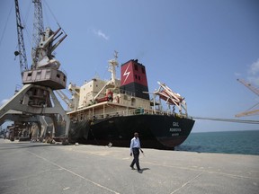 FILE - In this Saturday, Sept. 29, 2018, file photo, a cargo ship is docked at the port, in Hodeida, Yemen. Yemeni officials said Wednesday, Oct. 24, 2018 that the Saudi-led coalition has sent reinforcements to Yemen's west coast ahead of a fresh assault on the rebel-held port city of Hodeida.