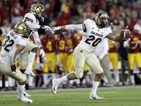 Colorado linebacker Drew Lewis (20) celebrates after intercepting a Southern California pass during the first half of an NCAA college football game Saturday, Oct. 13, 2018, in Los Angeles.