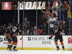 Anaheim Ducks' Ryan Kesler, right, celebrates after scoring against the Arizona Coyotes during the first period of an NHL hockey game Wednesday, Oct. 10, 2018, in Anaheim, Calif.