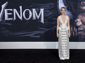 Michelle Williams arrives at the world premiere of "Venom" on Monday, Oct. 1, 2018, at the Regency Village Theater in Los Angeles.