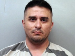 FILE - This file photo provided by the Webb County Sheriff's Office shows U.S. Border Patrol agent Juan David Ortiz. An attorney representing Ortiz, who is accused of killing four women in Texas is asking a judge to reduce his client's bond, claiming that conditions in jail amount to cruel and unusual punishment. An affidavit filed late last week says Ortiz has been denied clothing, eyeglasses and a toothbrush in his cell at the Webb County Jail in Laredo, where he has been held on $2.5 million bond since his arrest on Sept. 16, 2018. (Webb County Sheriff's Office via AP, File)