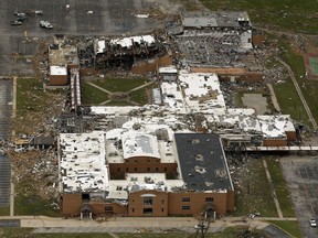 FILE - This May 24, 2011, file photo shows the damage to Joplin High School in Joplin, Mo., after a tornado swept through the area. An Associated Press analysis has found that tardiness in filing appeals to be reimbursed by the federal government after disasters has been the top reason why Federal Emergency Management Agency headquarters has denied appeals from cities, schools and other entities over the past year. The denied appeals include a total of $67 million sought by the tornado-ravaged schools of Joplin.