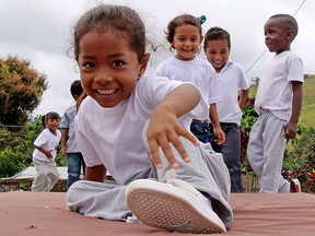 Happy school children at play in Chone, Ecuador