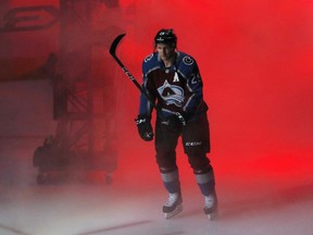 Colorado Avalanche center Nathan MacKinnon is introduced before the team NHL hockey game against the Minnesota Wild on Thursday, Oct. 4, 2018, in Denver.