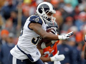 Los Angeles Rams running back Todd Gurley (30) runs against the Denver Broncos during the first half of an NFL football game, Sunday, Oct. 14, 2018, in Denver.