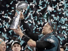 Philadelphia Eagles' Nick Foles holds up the Vince Lombardi Trophy after the NFL Super Bowl 52 football game against the New England Patriots, Sunday, Feb. 4, 2018, in Minneapolis. Will Canadian fans of big-budget, American Super Bowl ads get to see them while the NFL championship game is played next February, or will that be ruled out of bounds after just two seasons?
