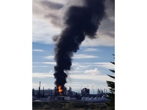 A fire and plume of smoke rises from an Irving Oil refinery following reports of an explosion in Saint John, N.B., on Monday, October 8, 2018. Irving Oil says a "major incident" happened at its oil refinery in Saint John, N.B., this morning.