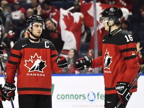 Canada's Dillon Dube, left, celebrates a goal against Switzerland with Taylor Raddysh (16) during third period quarter-final IIHF World Junior Championships hockey action in Buffalo, N.Y. on Tuesday, January 2, 2018. A change of scenery seems to be reinvigorating hockey fans' interest in an annual holiday tradition.Ticket demand for the 2019 International Ice Hockey Federation's World Junior Championship in Vancouver and Victoria has "exceeded expectations," said Riley Wiwchar, director of the tournament.THE CANADIAN PRESS/Nathan Denette