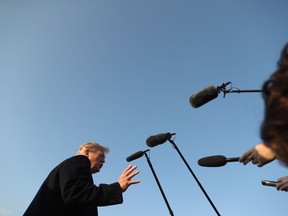 President Donald Trump arrives at Southern Illinois Airport in Murphysboro, Ill., Saturday, Oct. 27, 2018, for a rally. U.S. President Donald Trump is again setting his sights on the mainstream media as he seeks to deflect withering criticism of his firebrand style of angry political rhetoric.
