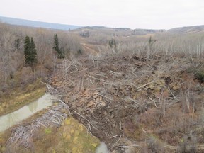 A slow moving landslide is seen inching down a hillside in northern British Columbia, prompting the evacuation of nearby Old Fort, B.C., in an undated handout photo.Power has been restored to a northeastern British Columbia community affected by a slowly slumping hillside, but the terrain around Old Fort continues to move and an evacuation order remains in effect.