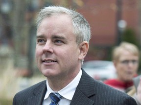 Dennis Oland heads from a bail hearing after being released from custody in Fredericton on Tuesday, Oct. 25, 2016. One of the most sensational murder cases in Canadian legal history will be back in the spotlight on Monday as jury selection begins for the retrial of Dennis Oland in the bludgeoning death of his millionaire father, Richard Oland.
