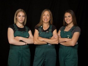 Dr. Michelle Oakley, centre, poses for a photo flanked by her two oldest daughters Maya, left, and Sierra in an undated handout photo. Oakley's love of animals began in her native Indiana where she spent summers on her uncle's dairy farm. She grew up a big fan of Jane Goodall, watching the famed anthropologist's TV specials "over and over again."