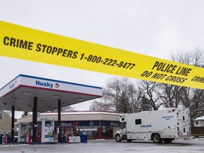 Homicide detectives investigate at a Mac's convenience store in Edmonton on December 18, 2015. A youth has pleaded guilty to manslaughter at the start of a murder trial into the shooting deaths of two Edmonton Mac's store workers. The 16-year old boy, who cannot be identified, admitted to manslaughter in relation to the 2015 death of clerk Karanpal Singh Bhangu.