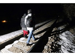 Early Sunday morning, February 26, 2017, migrants from Somalia cross into Canada illegally from the United States by walking down this train track into the town of Emerson, Man., where they will seek asylum at Canada Border Services Agency. The Canada Border Services Agency has been asked to "pick up the pace" in removing asylum seekers whose refugee claims have been rejected.