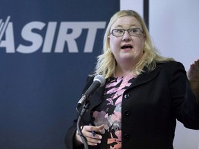 Susan Hughson, executive director Alberta Serious Indicent Response Team speaks at a press conference in Calgary, Alta. on Monday, Aug. 22, 2016. Alberta's police watchdog has cleared an officer who shot and killed a man armed with a hunting knife during a traffic stop.