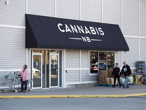 When cannabis becomes legally available to buy on Oct. 17, 2018, residents can make their purchases at 20 Cannabis NB retail stores across the New Brunswick. Shoppers, heading from a nearby grocery store, walk past one of the two locations in Saint John, N.B. on October 14, 2018. Cannabis NB has made some changes to its website after concerns were raised by Health Canada last week. The Crown agency came under scrutiny for its product descriptions and pictures of people smiling, posing for selfies and holding yoga poses - images that may violate federal regulations.
