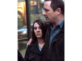 Kelly Ellard and her father Lawrence leave the Vancouver courthouse, March 30, 2000. A British Columbia woman who brutally beat and drowned 14-year-old Reena Virk near a Victoria-area bridge in 1997 has been granted an extension to her day parole.