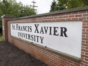 A sign marks one of the entrances to the St. Francis Xavier University campus in Antigonish, N.S. on Friday, Sept. 28, 2018. Students at the university are speaking out in response to the school's handling of a reported case of campus rape, calling for a review of its sexual violence policy to ensure a "survivor-centric" approach.