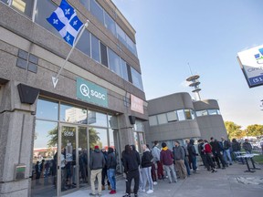 Customers lineup at a government cannabis store Friday, October 19, 2018 in Montreal on the third day of the legal cannabis sales in Canada.