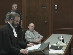 A Saskatoon man who was found guilty of killing his wife is appealing his conviction, saying the judge erred in directing the jury. David Woods, right, looks on as his lawyer, James Streeton, addresses the court in a still frame made from live stream video footage in Saskatoon on Tuesday, Oct. 2, 2018.