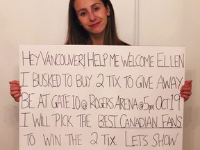 Capri Everitt holds a sign as she poses in this recent handout photo. Fourteen-year-old Capri Everitt of Vancouver bought two tickets to Ellen Degeneres's performance in Vancouver with money she'd earned busking. She planned to give them away to fans based on their singing of O Canada outside Rogers Arena tomorrow night before show time. But then she was given 80 tickets to give away. THE CANADIAN PRESS/HO - Capri Everitt