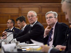 Border Security Minister Bill Blair is launching a national public conversation about whether Canada should ban handguns and assault weapons, following through on a commitment in his mandate letter. Blair appears as a witness at a standing committee on public safety and national security on Parliament Hill in Ottawa on Tuesday, Sept. 25, 2018.