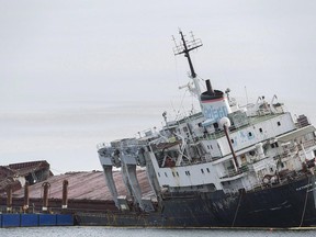 The cargo ship, Kathryn Spirit is shown run aground on Lac Saint-Louis near Montreal on November 10, 2016. For 11 years, the Kathryn Spirit loomed over the waterfront in Beauharnois, a rusting, abandoned cargo ship that to the town's dismay became one of its most identifiable features. On Friday, federal Transport Minister Marc Garneau announced that after a number of false starts, the ship has finally been dismantled and hauled away.