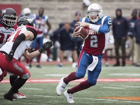 Montreal Alouettes quarterback Johnny Manziel is pressured by the Calgary Stampeders defence during second half CFL football action in Montreal, Monday, October 8, 2018. They're both out of the playoffs but the Toronto Argonauts and Montreal Alouettes still have plenty to play for Saturday when they meet at BMO Field.