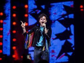 Canadian streaming platform CraveTV is turning a well-known pop culture podcast into a small-screen talk show. Max Kerman, lead singer for The Arkells performs during the We Day event in Toronto on Thursday, Sept. 20, 2018. "Mike on Much" is hosted by Kerman, director Mike Veerman and YouTuber Shane Cunningham. Each TV episode features a roundtable discussion on a range of topics, including music, pop culture and entertainment.