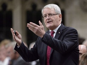Transportation Minister Marc Garneau responds during question period in the House of Commons on Parliament Hill, in Ottawa on October 4, 2018. Transport Minister Marc Garneau is ordering his department to take a fresh look at the data on school bus safety and seatbelts to see if new regulations are needed. Garneau says seatbelts on buses, when properly used and installed, can provide an additional layer of safety for riders, but notes that current seat designs already provide good safety in the event of an accident.