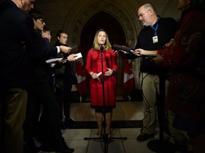 Minister of Foreign Affairs Chrystia Freeland speaks to reporters on Parliament Hill in Ottawa on Monday, Oct. 15, 2018. After more than a year of leading intense trade negotiations with the United States and Mexico, the first thing Foreign Affairs Minister Chrystia Freeland did when the new agreement was signed was lie down on the floor of the Prime Minister's office.