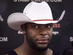 Calgary Stampeders' Charleston Hughes speaks to reporters at the team's clubhouse in Calgary, Tuesday, Nov. 28, 2017. Hughes faces impaired driving charges.
