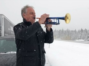 Professional trumpet soloist Jens Lindemann is shown on the Trans Canada Highway east of Canmore, Alta., on Oct. 2, 2018. He was one of hundreds of motorists stranded on the highway during a record autumn snowstorm.