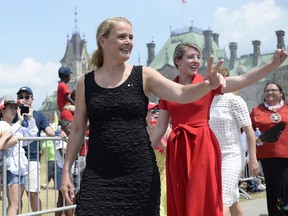 Governor General Julie Payette and Minister of Canadian Heritage Melanie Joly wave as they arrive for Canada Day celebrations on Parliament Hill in Ottawa on Sunday, July 1, 2018. Payette will make her first official visit to Saskatchewan today and take in a Humboldt Broncos hockey game this weekend.