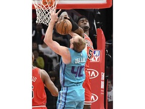 Chicago Bulls forward Bobby Portis (5) blocks the shot of Charlotte Hornets forward Cody Zeller (40) during the first half of a NBA basketball game Wednesday, Oct. 24, 2018, in Chicago.