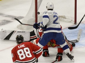 Tampa Bay Lightning center Brayden Point (21) scores against the Chicago Blackhawks during the second period of an NHL hockey game on Sunday Oct. 21, 2018, in Chicago.