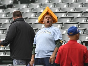A Milwaukee Brewers fan yells in the stands before a baseball game against the Chicago Cubs on Monday, Oct. 1, 2018, in Chicago. Milwaukee visits Chicago on Monday for the first tiebreaker in major league history in which the loser doesn't go home. The winner advances to the Division Series, the loser to Tuesday's wild-card game against the loser of the NL West tiebreaker later Monday between Colorado and the Los Angeles Dodgers.