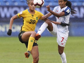 Jamaica midfielder Giselle Washington (20) and Panama midfielder Kenia Rangel (7) battle for the ball during the first half of the third place match of the CONCACAF women's World Cup qualifying tournament, Wednesday, Oct. 17, 2018, in Frisco, Texas.