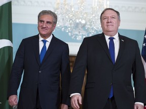 Secretary of State Mike Pompeo, right, meets Pakistani Foreign Minister Makhdoom Shah Mahmood Qureshi at the State Department in Washington, Tuesday, Oct. 2, 2018.