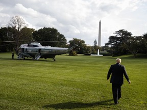 President Donald Trump walks to Marine One after speaking with reporters on the South Lawn of the White House, Tuesday, Oct. 9, 2018, in Washington.