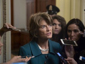 Republican Sen. Lisa Murkowski of Alaska, speaks with reporters just after a deeply divided Senate pushed Brett Kavanaugh's Supreme Court nomination past a key procedural hurdle, setting up a likely final showdown vote for Saturday, at the Capitol in Washington, Friday, Oct. 5, 2018.