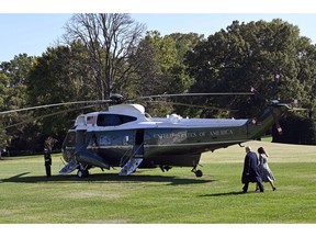 President Donald Trump and first lady Melania Trump walk from the Oval Office of the White House in Washington, Tuesday, Oct. 30, 2018, to Marine One on the South Lawn for the short trip to Andrews Air Force Base. The Trumps are heading to Pittsburgh following the synagogue massacre.