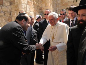 National Post columnist Father Raymond J. de Souza shakes hands with Pope Benedict at the Western Wall in Jerusalem on May 12, 2009.