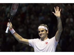 Switzerland's Roger Federer cheers after winning the final against Romania's Marius Copil at the Swiss Indoors tennis tournament at the St. Jakobshalle in Basel, Switzerland, on Sunday, Oct. 28, 2018.