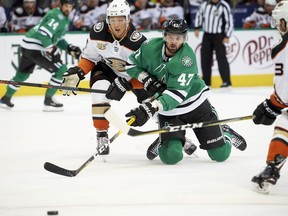 Dallas Stars right wing Alexander Radulov (47), of Russia, battles for the puck with Anaheim Ducks defenseman Brandon Montour (26) during the first period of an NHL hockey game Saturday, Oct. 13, 2018, in Dallas.