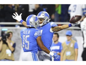 Detroit Lions wide receiver Marvin Jones, right celebrates his 39-yard reception for a touchdown with teammate wide receiver Golden Tate (15) during the first half of an NFL football game against the Seattle Seahawks, Sunday, Oct. 28, 2018, in Detroit.