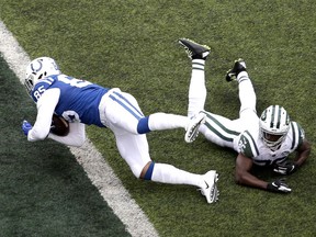 Indianapolis Colts tight end Eric Ebron (85) dives in over New York Jets free safety Marcus Maye (26) for a touchdown on a pass from quarterback Andrew Luck, not pictured, during the second half of an NFL football game, Sunday, Oct. 14, 2018, in East Rutherford, N.J.